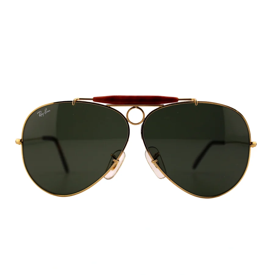 1988 rayban gold-tone aviator shooter sunglasses with red brow bar