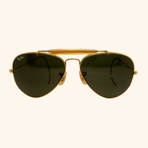 Retro Ray-Ban Outdoorsman shades from 1985—bold gold frame and iconic G-15 lenses built for adventure.