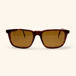 Vintage Ray-Ban W1702 sunglasses with tortoise-shell frame and amber Chromax lenses, made in USA circa 1995.