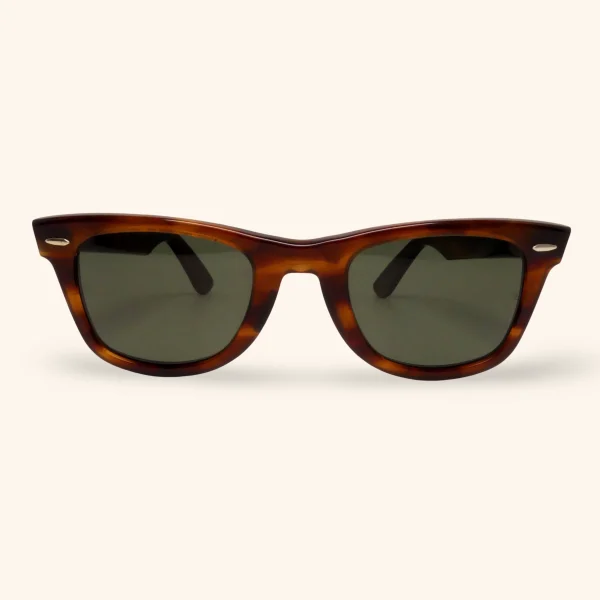 1984 Ray-Ban Wayfarer sunglasses with tortoise shell acetate frame and original BL G-15 mineral glass lenses, famously worn by Don Johnson in Miami Vice.